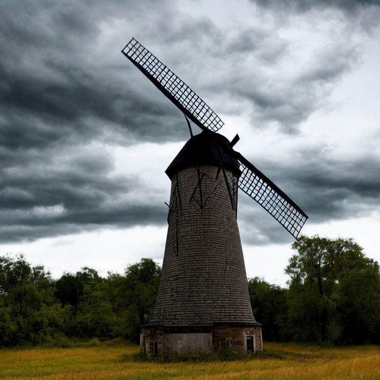Traditional Wooden Windmill in Stormy Field