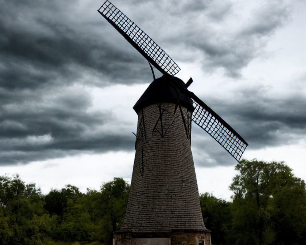 Traditional Wooden Windmill in Stormy Field