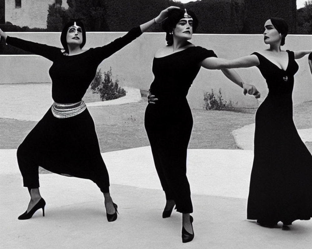 Three Women Performing Synchronized Dance Outdoors