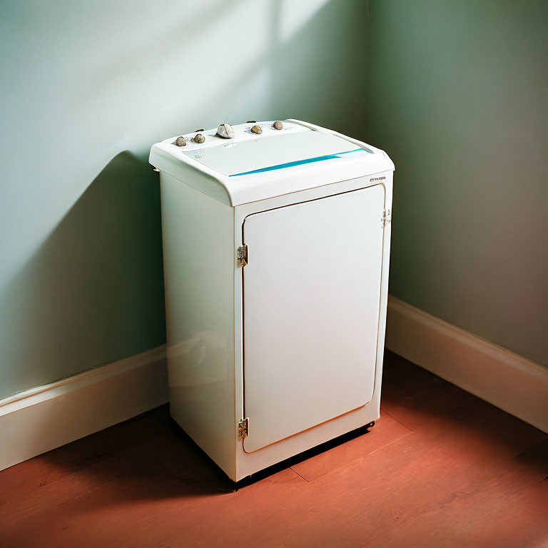 Vintage White Washing Machine with Analog Controls in Sunlit Corner