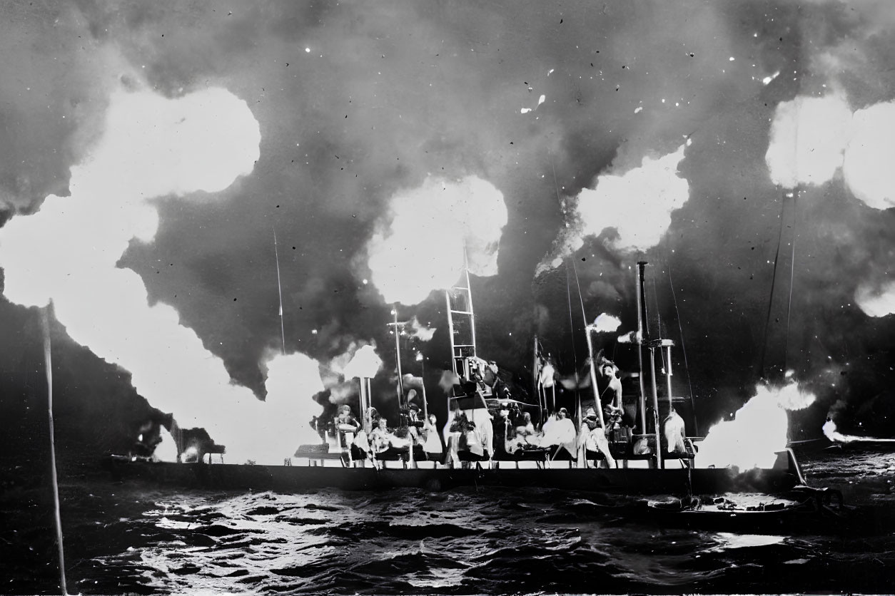 Monochrome historical image of ship ablaze at sea