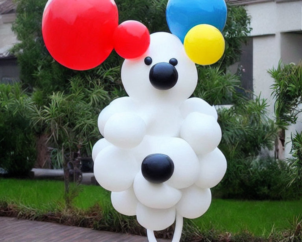 White Dog Balloon Sculpture with Colorful Balloons in Residential Setting