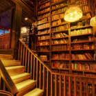 Whimsical library with arched ceilings and dragon figures reading and climbing.