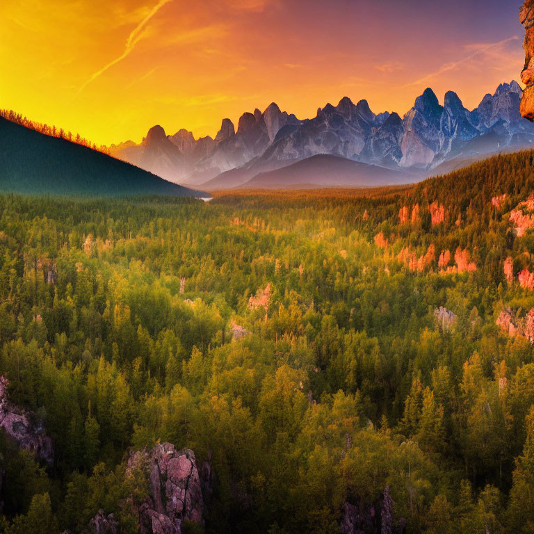 Scenic sunset over forest with rocky mountain silhouette