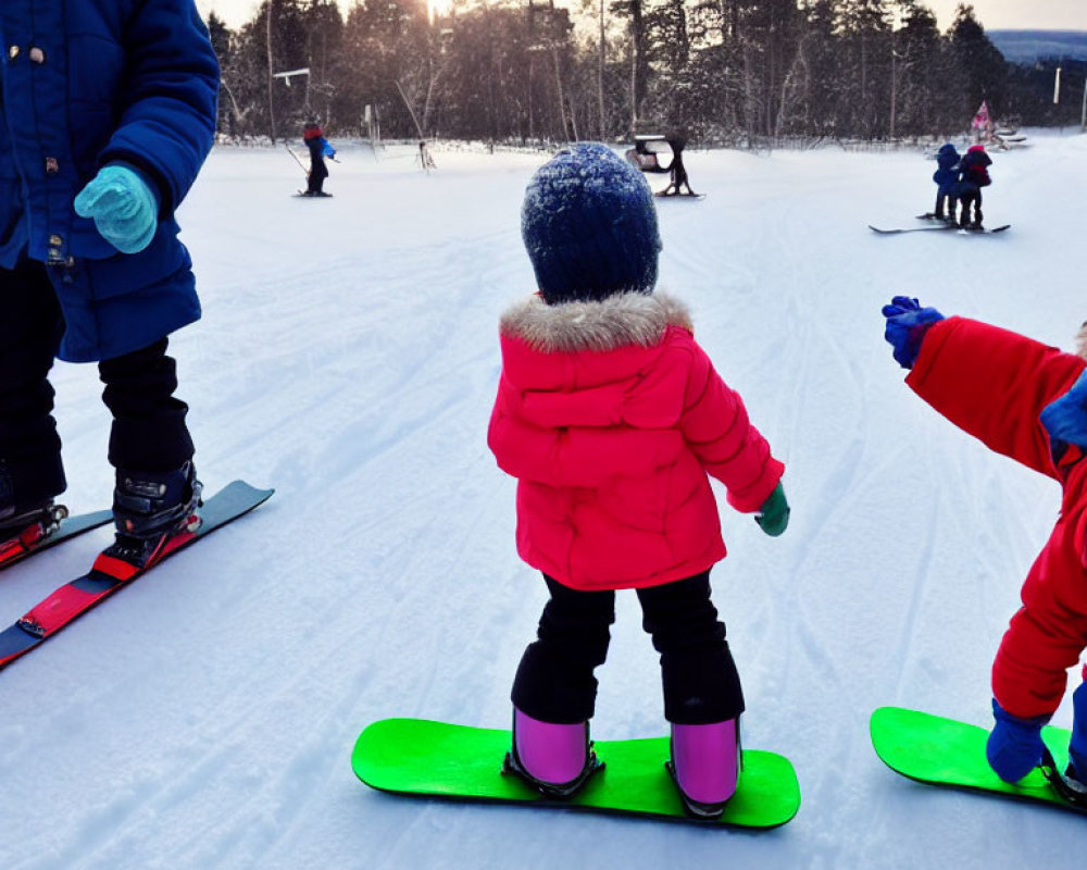 Child in Red Jacket Learning Snowboarding with Instructor on Snowy Slope