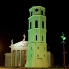 Nighttime artistic depiction of illuminated historic tower under starry sky