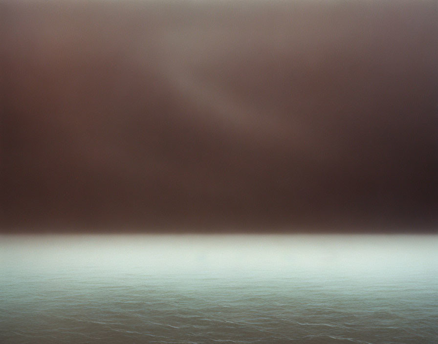 Murky ocean under heavy haze with gradient to horizon