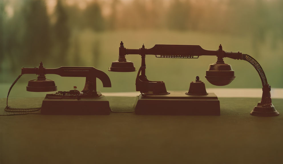 Assorted vintage telephones on table with varied designs