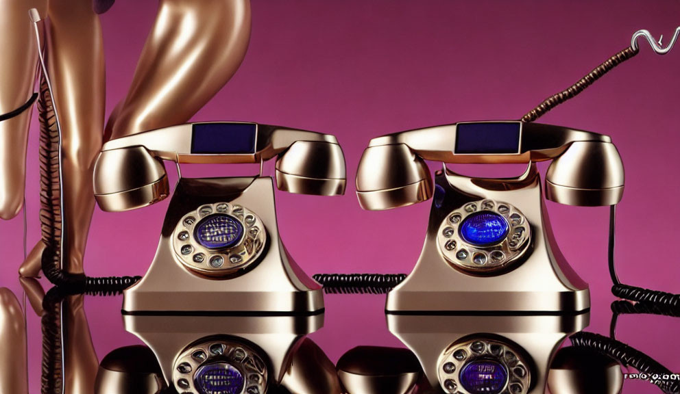 Vintage Golden Telephones with Blue Rotary Dials on Purple Background