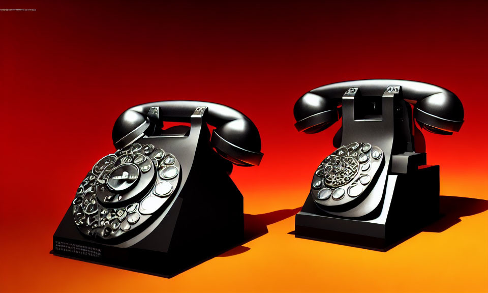 Vintage rotary dial telephones on orange background, facing left and right