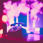 Vintage Telephone Silhouette on Vibrant Pink and Purple Bokeh Background