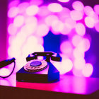 Vintage Rotary Phone on Pink and Purple Bokeh Background