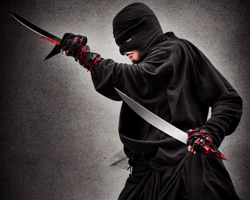 Ninja costume with sword in focused stance on grey background