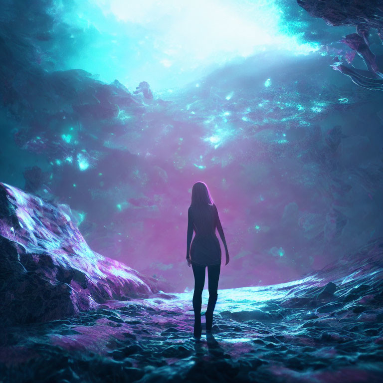 Silhouette of woman facing vibrant bioluminescent cave