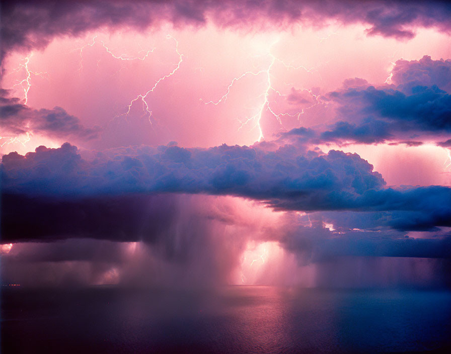 Intense thunderstorm over the sea with lightning and heavy rain