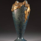 Art Nouveau Style Vase with Woman's Face, Blue Patterns, and Gold Detailing