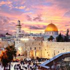 Majestic complex with golden domes and illuminated buildings at dusk