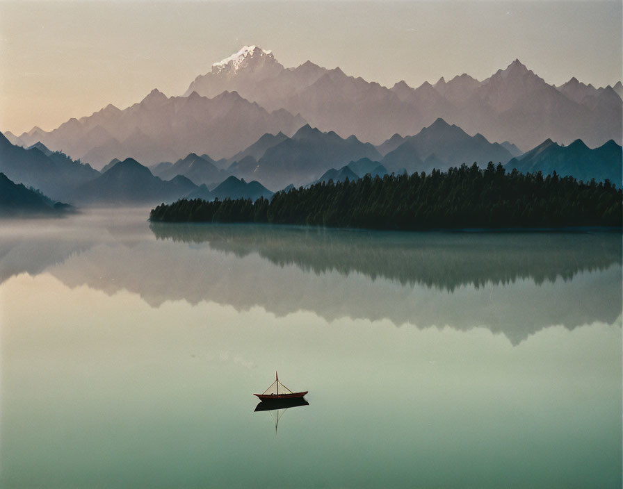 Tranquil lake scene: mountain reflection, dusk, lone boat