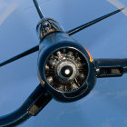 Airplane in Flight: Landing Gear, Jet Engine, and Propellers in Close-up View