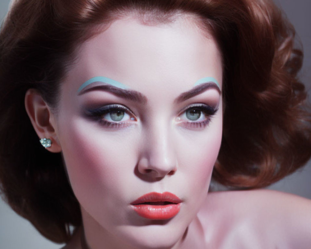 Woman with Blue Eyeshadow and Red Lips in Dramatic Makeup Portrait