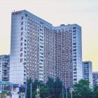 Abandoned high-rise building in construction site at dawn or dusk