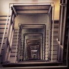 Dimly Lit Concrete Staircase in Industrial Setting