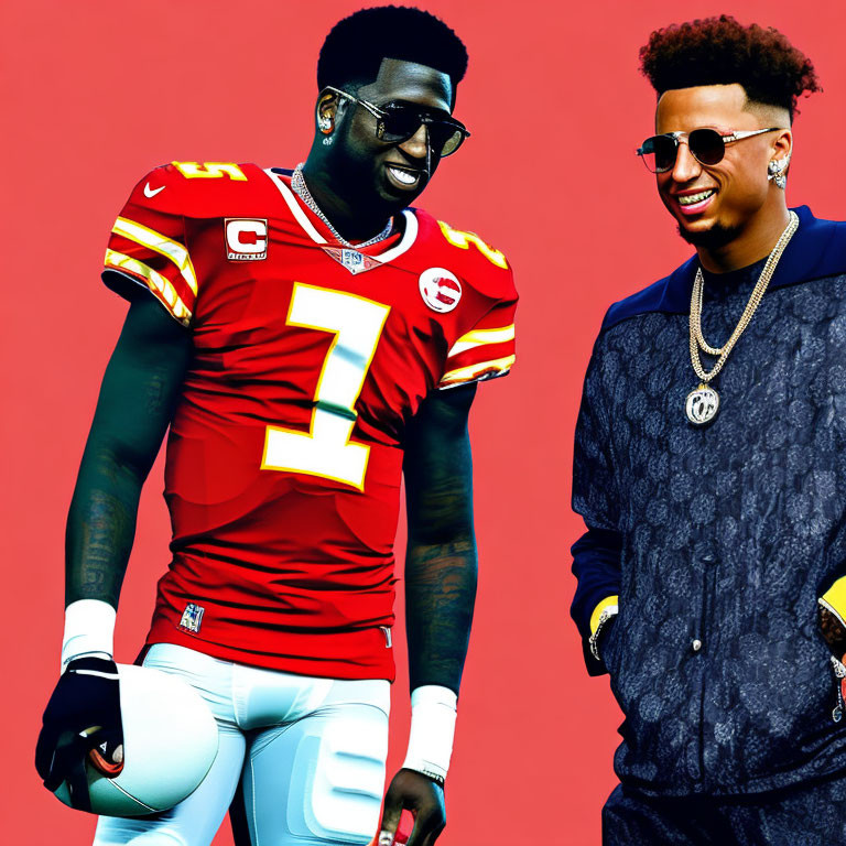 Two men in red American football and casual attire pose against red backdrop