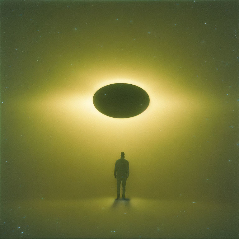 Silhouetted figure in front of glowing circular portal on starry backdrop