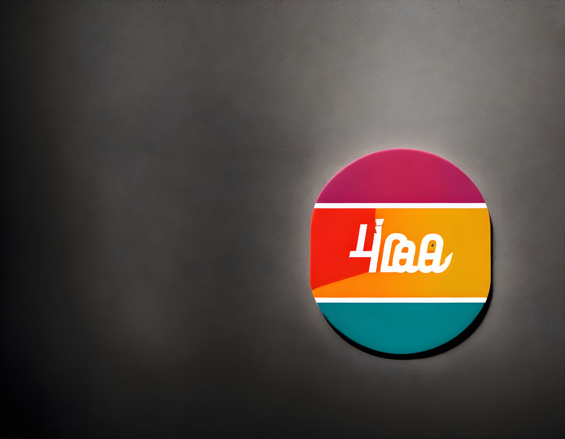 Circular colorful logo with retro design & Cyrillic script on grey background with vignette effect