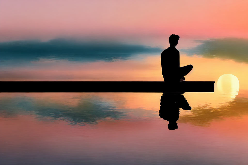 Silhouette of Person Sitting on Pier at Sunset