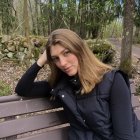 Auburn-Haired Person in Thought Against Abstract Background