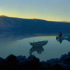 Person rowing boat on calm lake with mountain-like figures at dusk