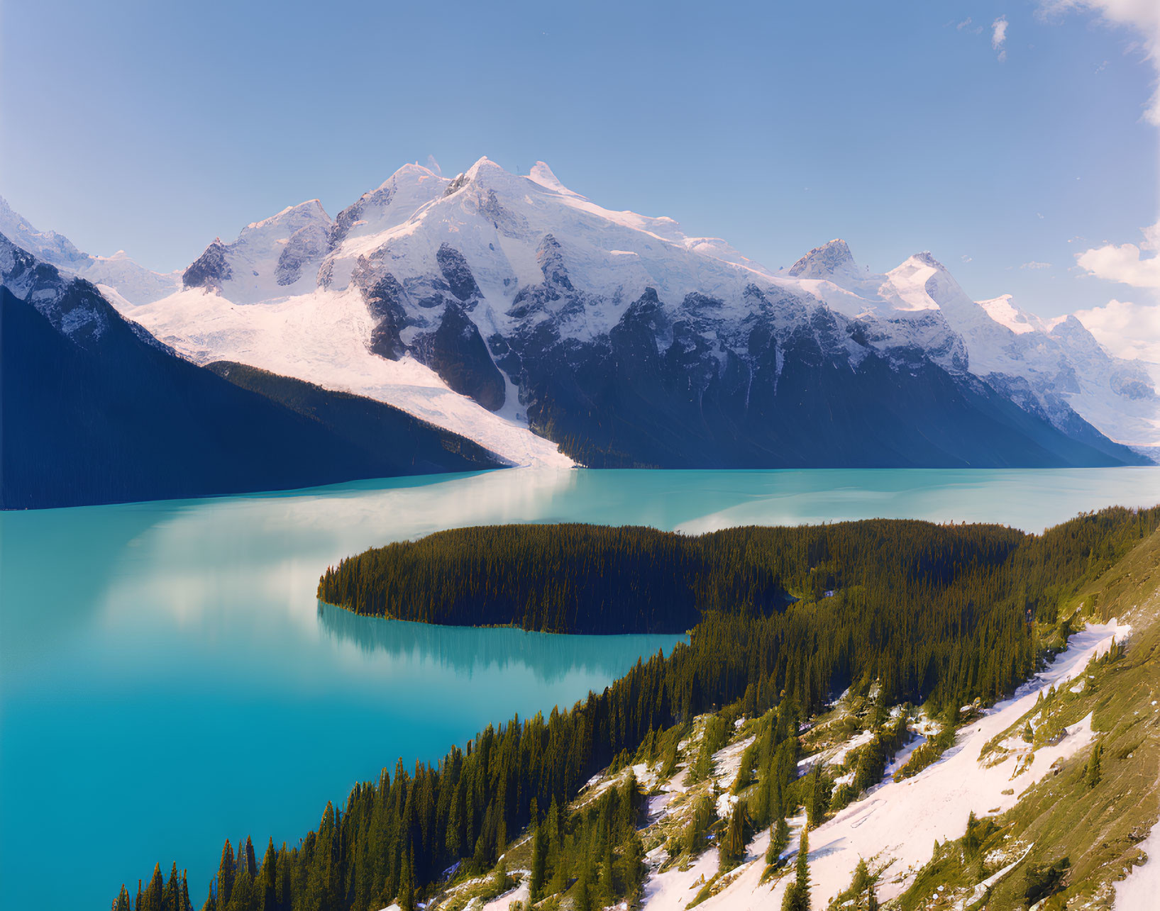 Turquoise Lake Surrounded by Snow-Capped Mountains