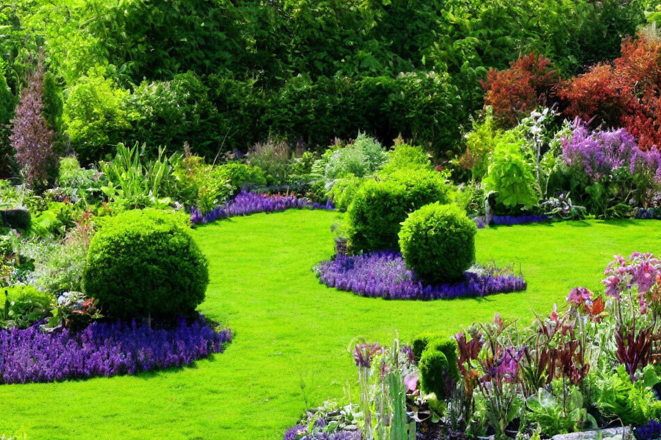 Manicured garden with green grass, trimmed hedges, colorful blooms