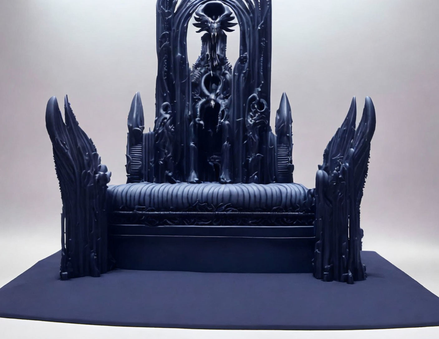 Gothic-style sculpted black throne with ornate high backrest and winged chairs