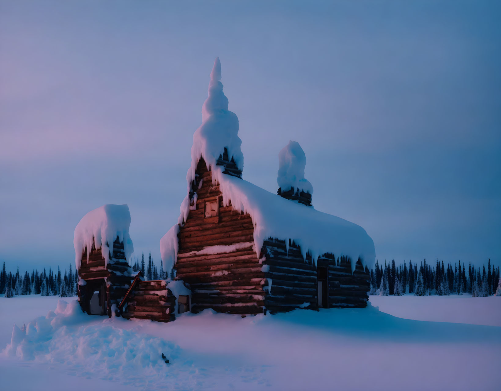 Snow-covered wooden structures in serene twilight winter landscape.