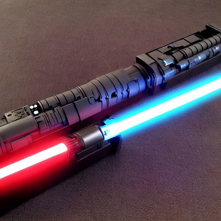 Crossed red and blue lightsabers on textured surface symbolize opposing forces