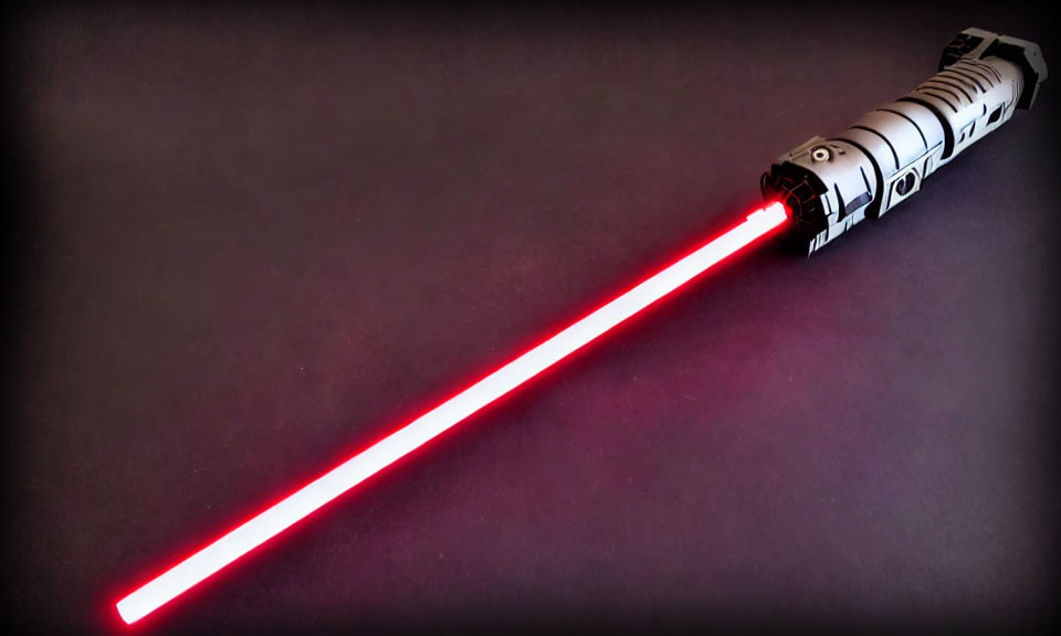 Detailed Red Lightsaber with Illuminated Hilt on Dark Background