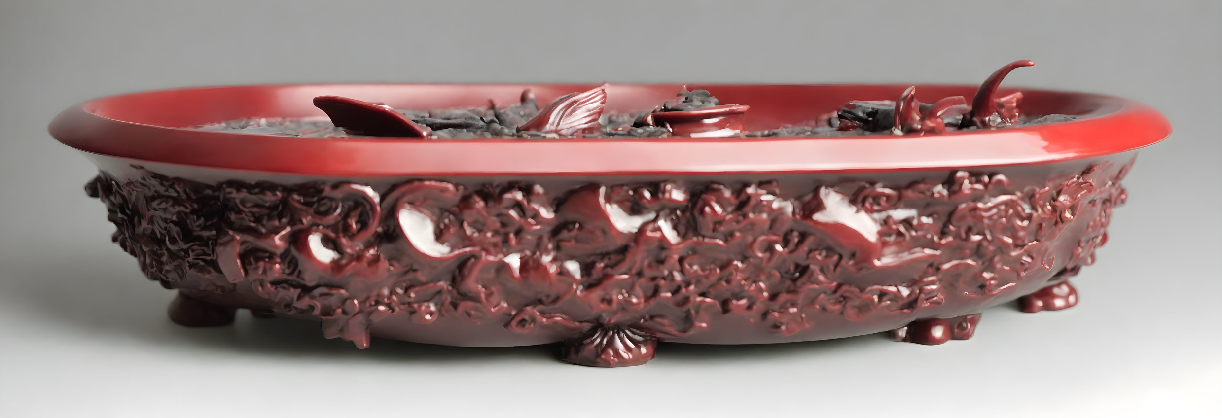 Red Ceramic Bowl with Leaf and Floral Relief Decoration