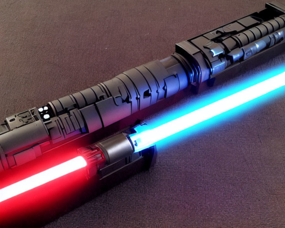 Crossed red and blue lightsabers on textured surface symbolize opposing forces