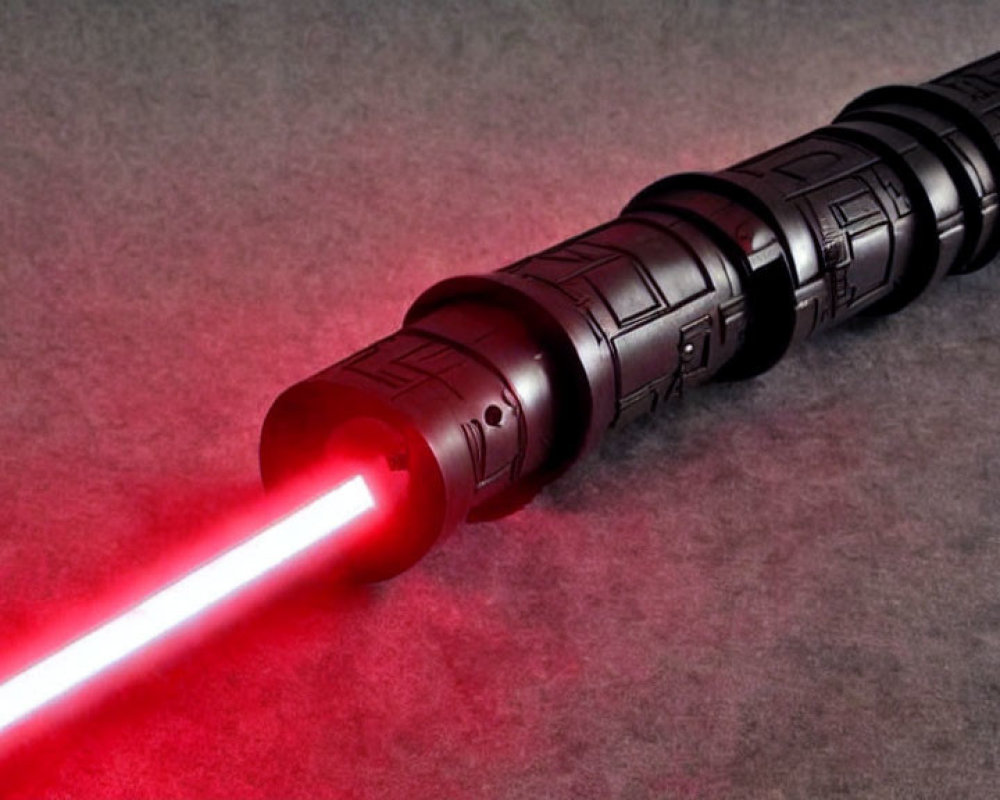 Intricately designed red lightsaber on dark background