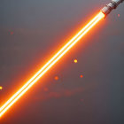 Glowing Orange Lightsaber on Red Background with Floating Particles