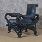 Dark Blue Armchair with Baroque Design on Gray Background