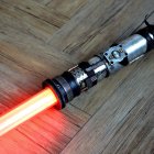 Intricately designed red lightsaber on dark background