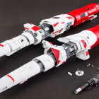 Detailed Red and White Model Spaceships Next to Dismantled Craft