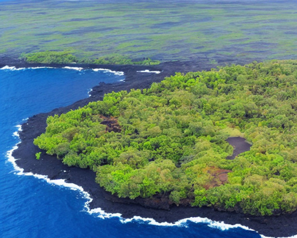 Lush Green Peninsula with Volcanic Shores and Blue Ocean View