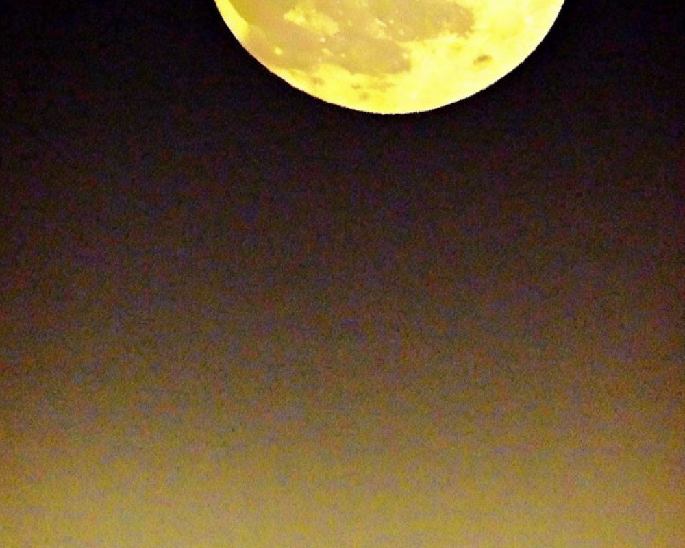 Bright full moon in dark sky with gradient to warm yellow.