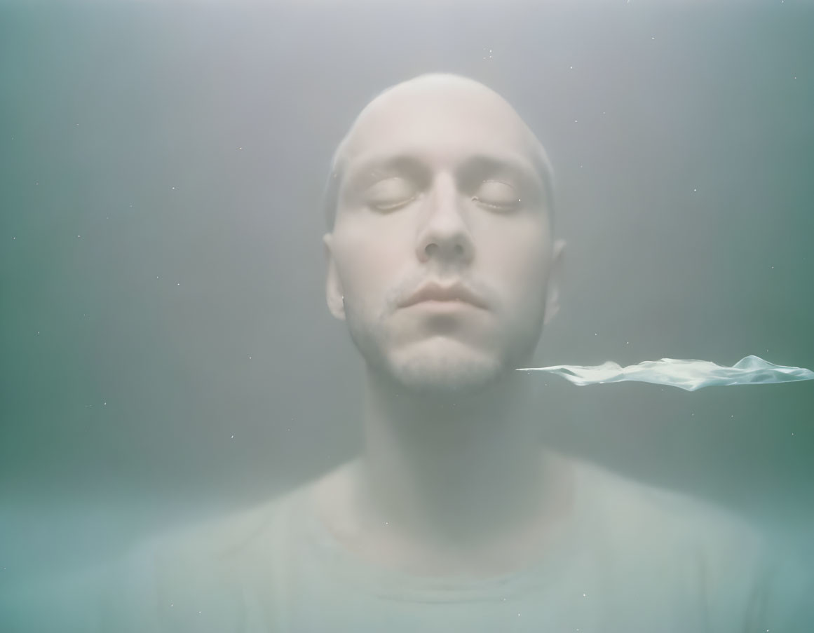 Man with Closed Eyes Submerged in Water with Rippling Wave