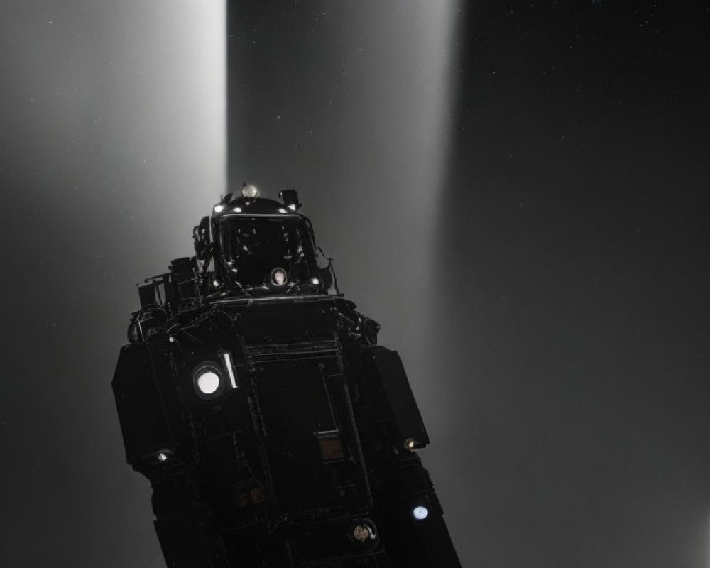 Tall Black Lighthouse Beaming Light in Dark Sky