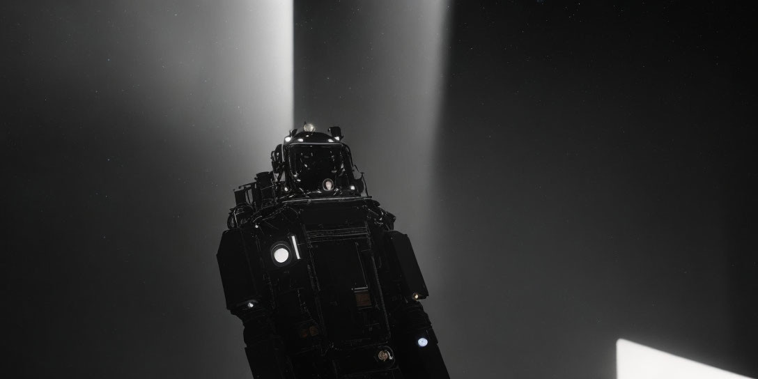 Tall Black Lighthouse Beaming Light in Dark Sky